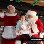 Santa-goes-to-boo-bar-8-150x150 Santa and Mrs. Claus visit BooBar with gifts for Fire Dept.
